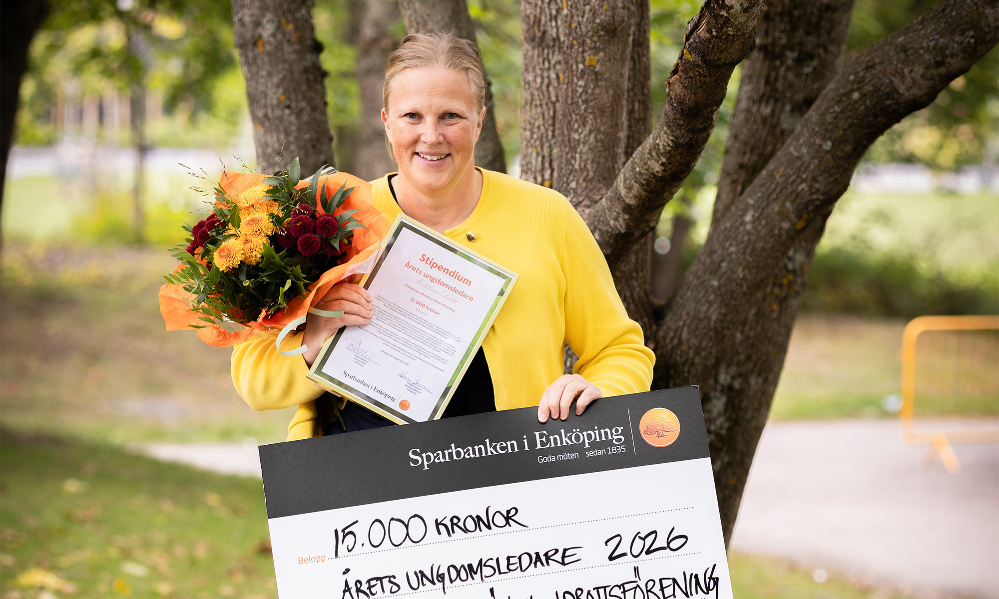 Woman holding a check 